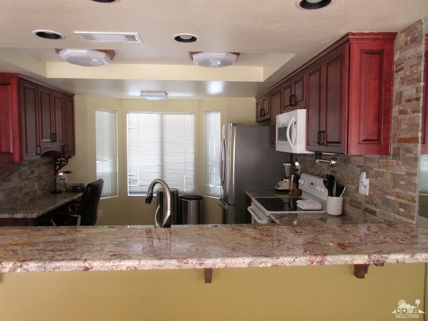1 Pacifica Lane Palm Desert, CA 92260 - Photo 11 of 22 a kitchen with sink and window