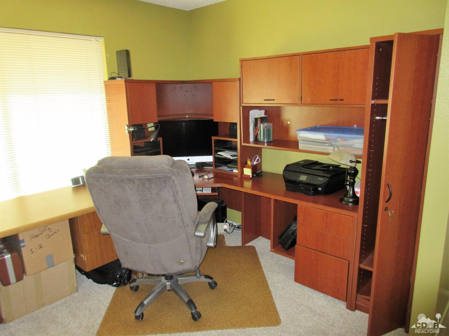1 Pacifica Lane Palm Desert, CA 92260 - Photo 20 of 22 a room with furniture and a flat screen tv