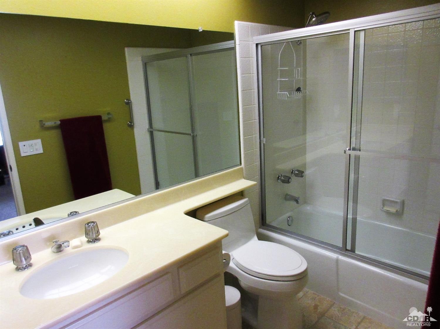 1 Pacifica Lane Palm Desert, CA 92260 - Photo 21 of 22 a bathroom with a sink a toilet and shower