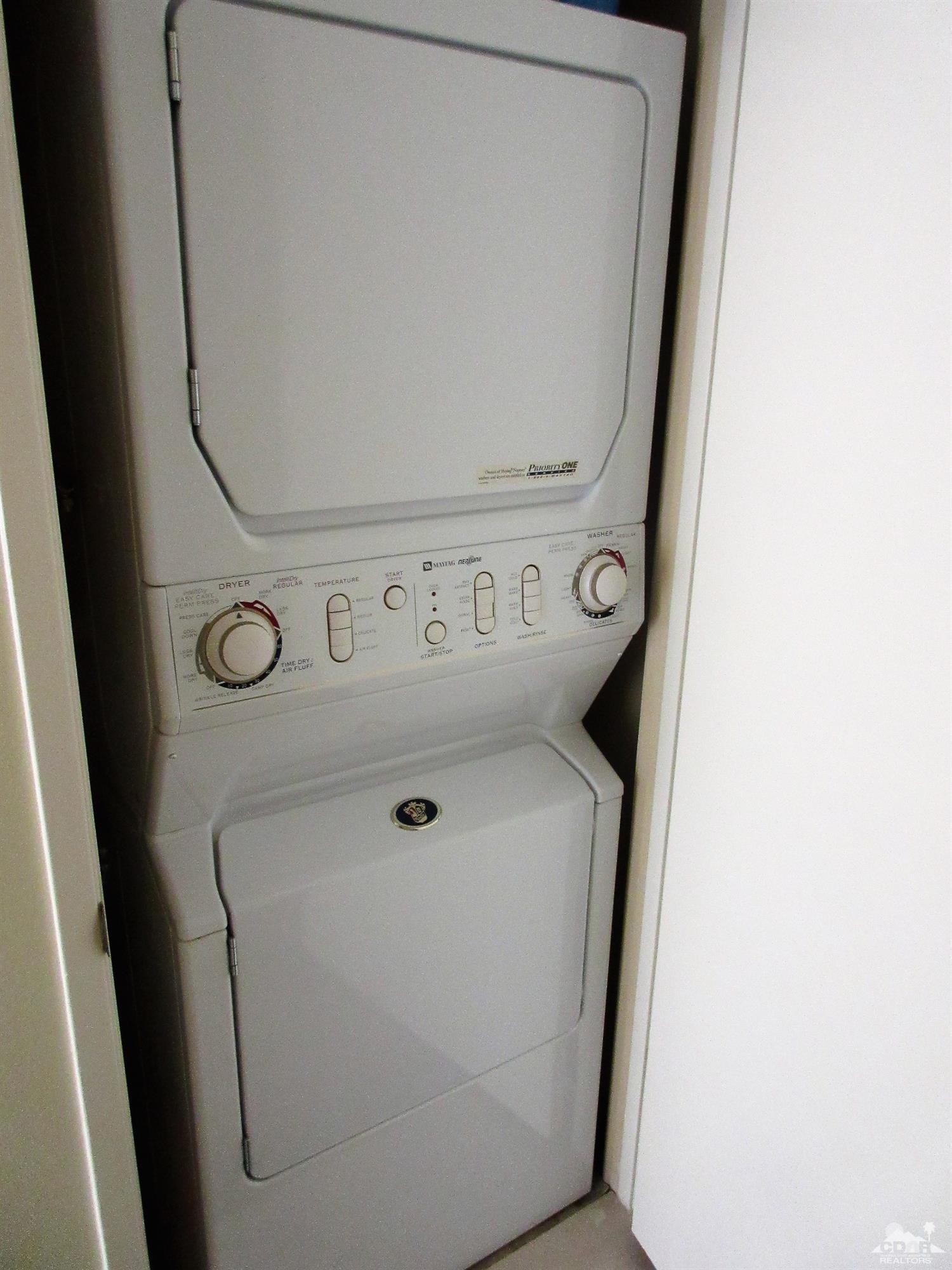 1 Pacifica Lane Palm Desert, CA 92260 - Photo 22 of 22 a utility room with dryer and washer