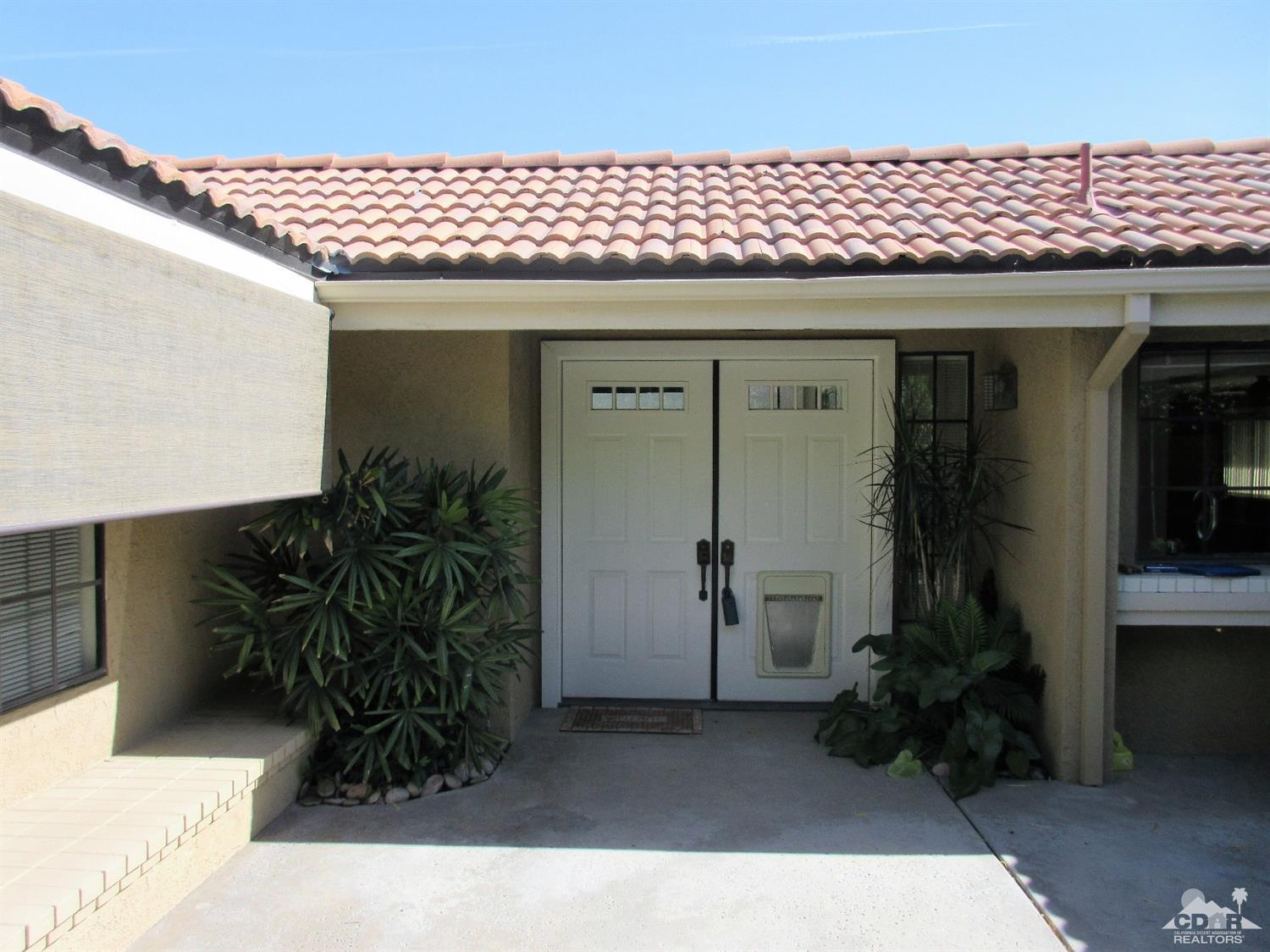 1 Pacifica Lane Palm Desert, CA 92260 - Photo 4 of 22 a front view of a house