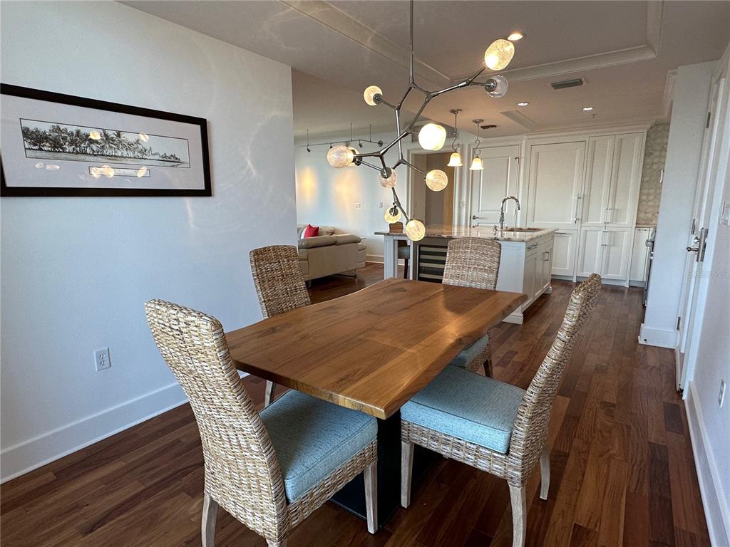 1350 Main Street, Unit 1401 Sarasota, FL 34236 - Photo 14 of 69 a view of a dining room with furniture