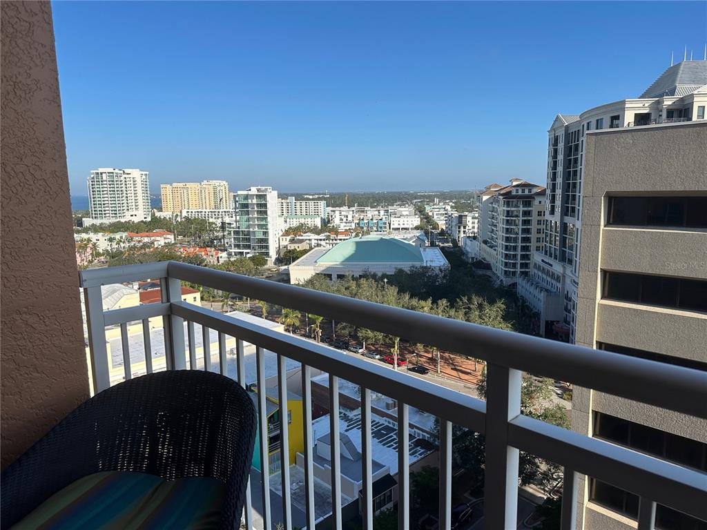 1350 Main Street, Unit 1401 Sarasota, FL 34236 - Photo 17 of 69 a view of a balcony with an outdoor seating