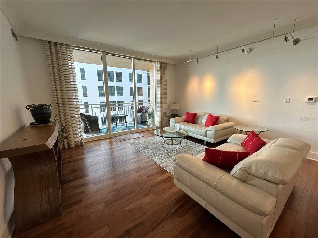 1350 Main Street, Unit 1401 Sarasota, FL 34236 - Photo 30 of 69 a living room with furniture and a large window