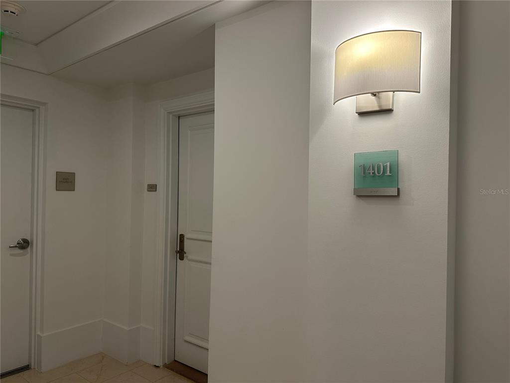 1350 Main Street, Unit 1401 Sarasota, FL 34236 - Photo 3 of 69 a bathroom with a light fixture and a mirror