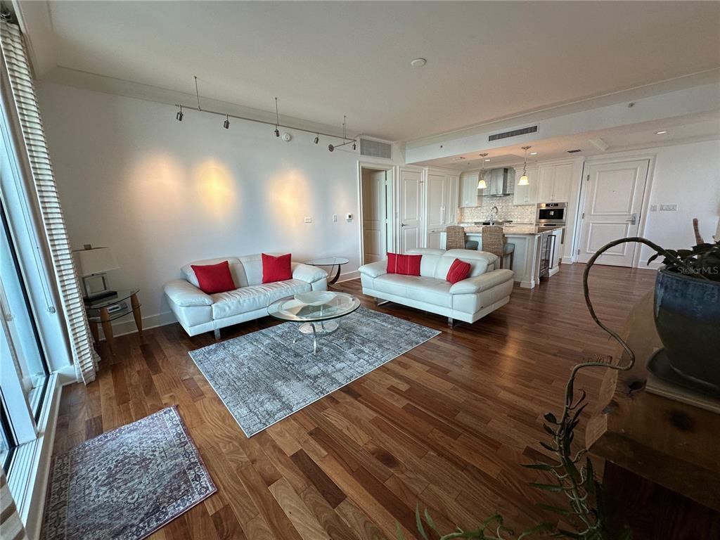 1350 Main Street, Unit 1401 Sarasota, FL 34236 - Photo 33 of 69 a living room with furniture and wooden floor