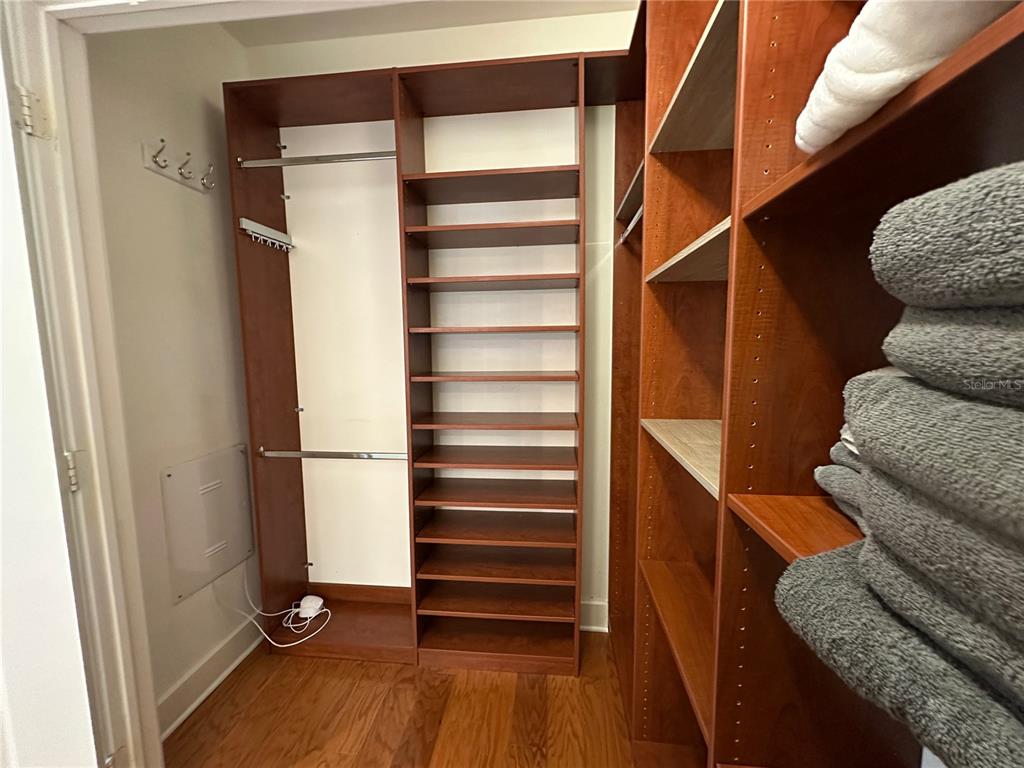 1350 Main Street, Unit 1401 Sarasota, FL 34236 - Photo 44 of 69 a view of walk in closet with clothes and shoes