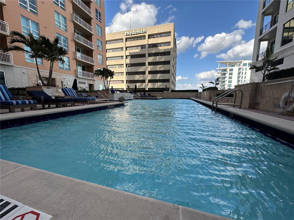 1350 Main Street, Unit 1401 Sarasota, FL 34236 - Photo 48 of 69 a view of a swimming pool with a yard