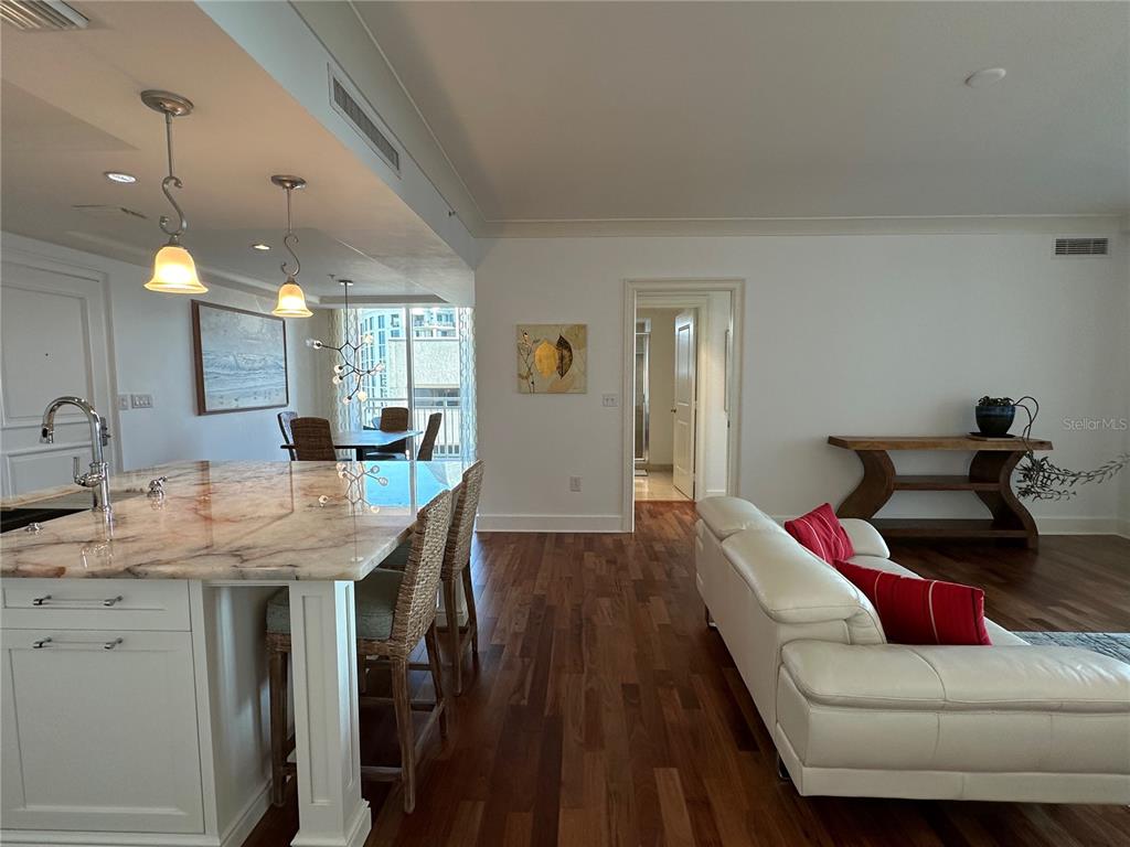 1350 Main Street, Unit 1401 Sarasota, FL 34236 - Photo 6 of 69 a living room with furniture and a wooden floor