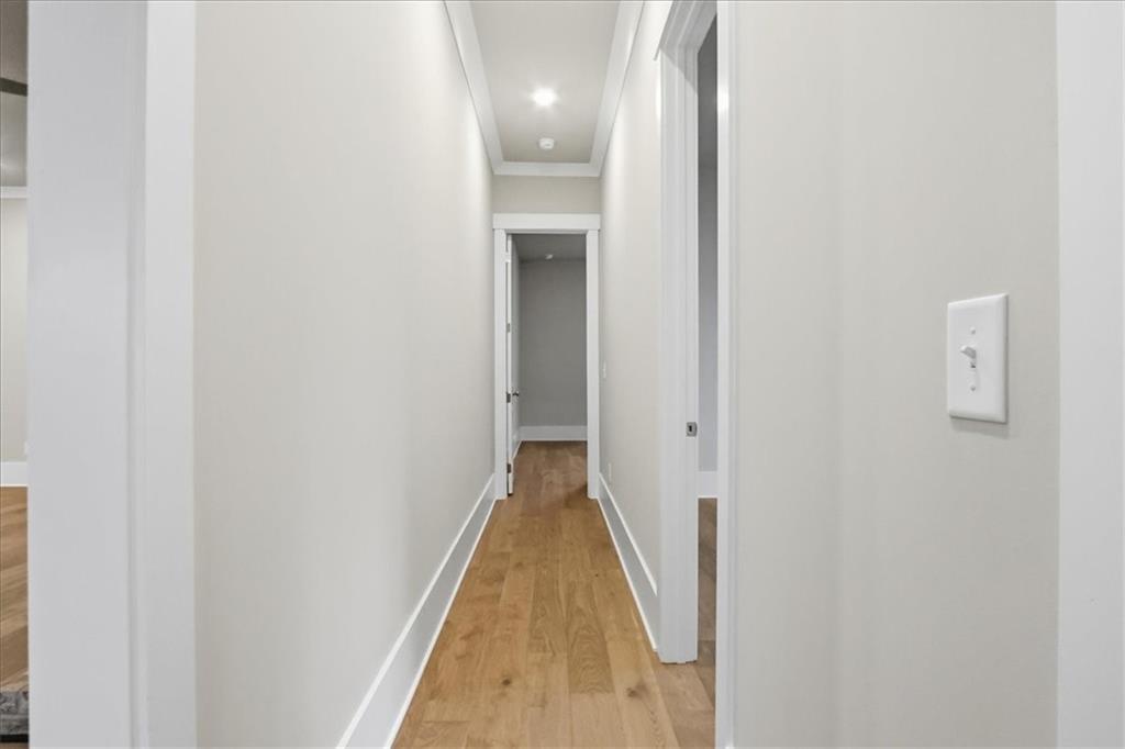 216 Ewing Way Dacula, GA 30019 - Photo 42 of 80 a view of a hallway with wooden floor