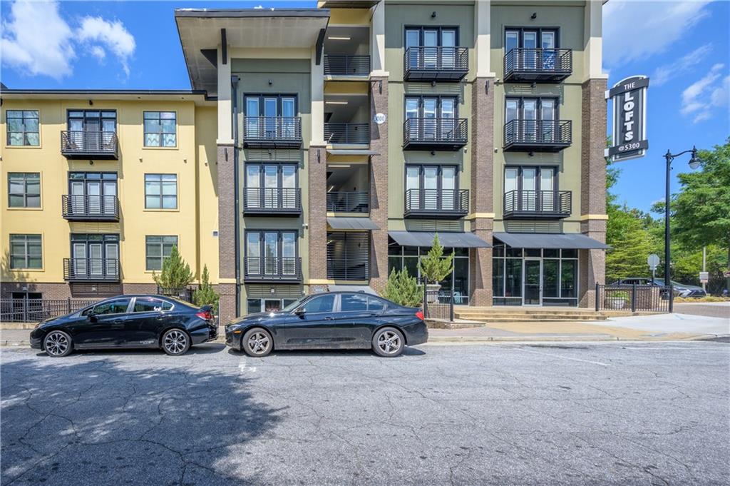 a car parked in front of a brick building