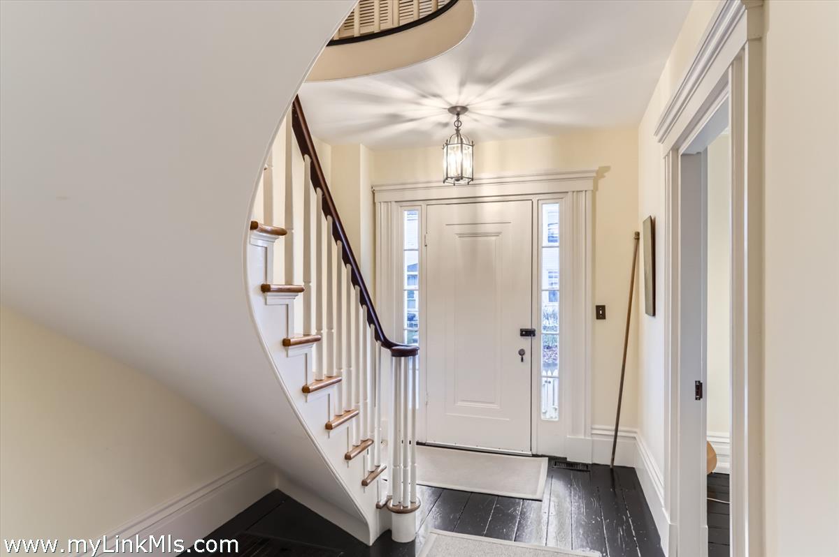 27 Spring Street Vineyard Haven, MA 02568 - Photo 16 of 58 a view of entryway and hall with wooden floor