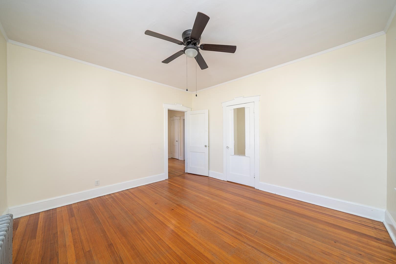 168 West Passaic Street, Unit 2 Maywood, NJ 07607 - Photo 13 of 22 a view of room with wooden floor and ceiling fan