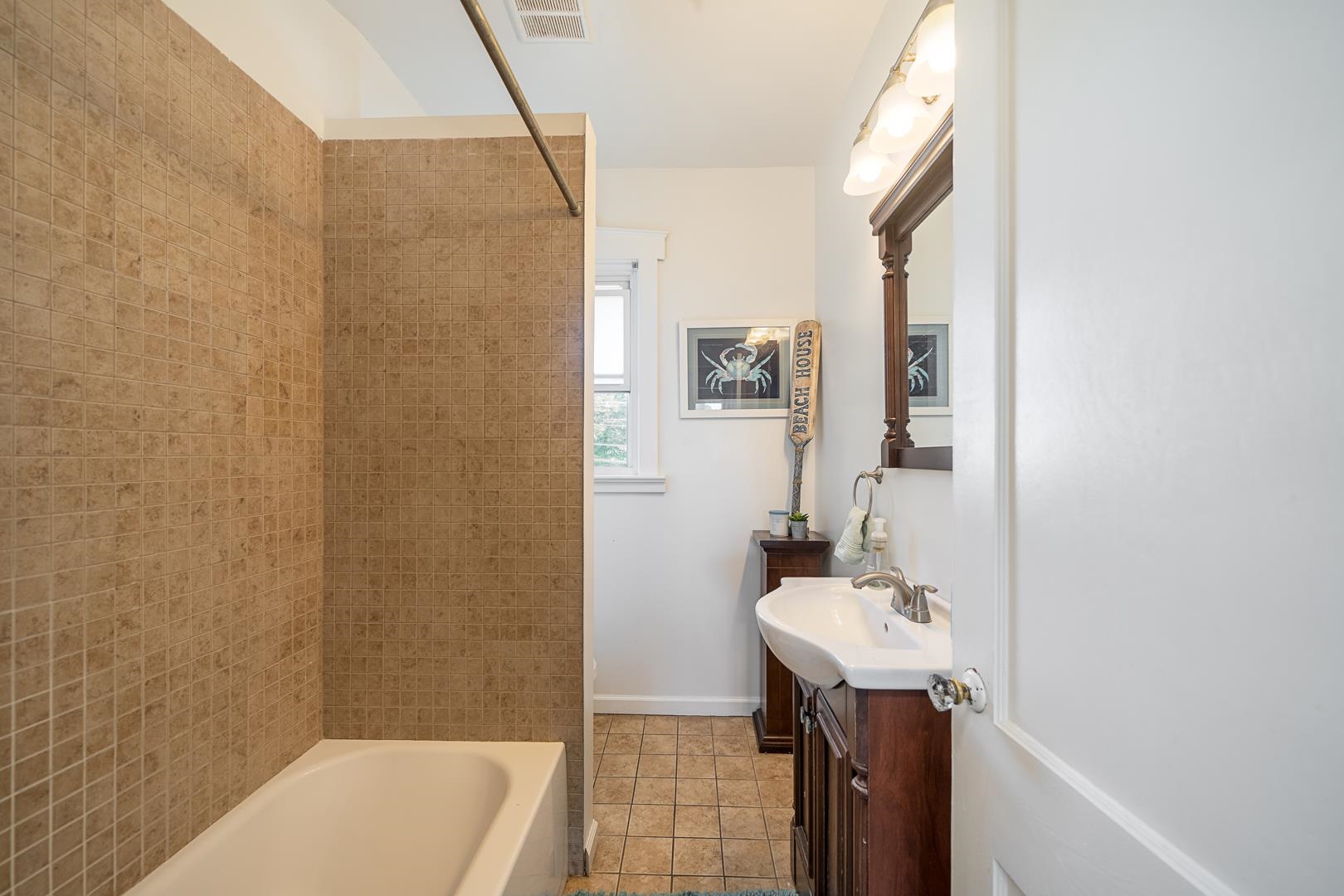 168 West Passaic Street, Unit 2 Maywood, NJ 07607 - Photo 16 of 22 a bathroom with a sink a toilet and shower