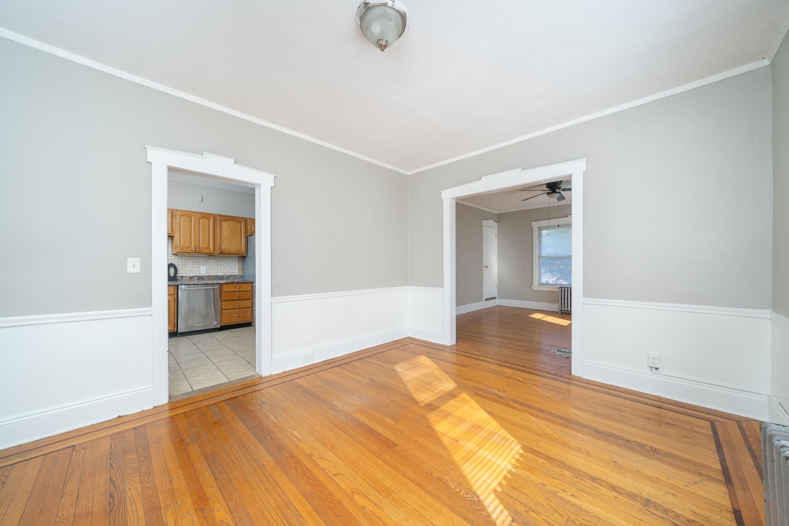 168 West Passaic Street, Unit 2 Maywood, NJ 07607 - Photo 4 of 22 a view of a livingroom with wooden floor and a bathroom