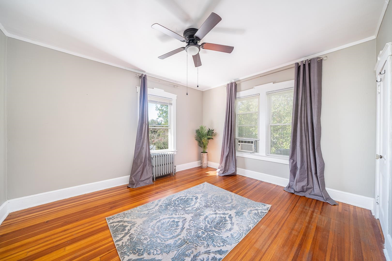 168 West Passaic Street, Unit 2 Maywood, NJ 07607 - Photo 8 of 22 a view of an empty room with a window and wooden floor