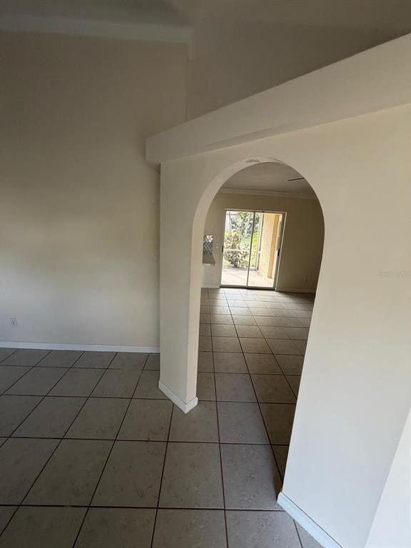 120 Southwest Bedford Road Port St. Lucie, FL 34953 - Photo 17 of 50 an empty room with a fireplace and mirror