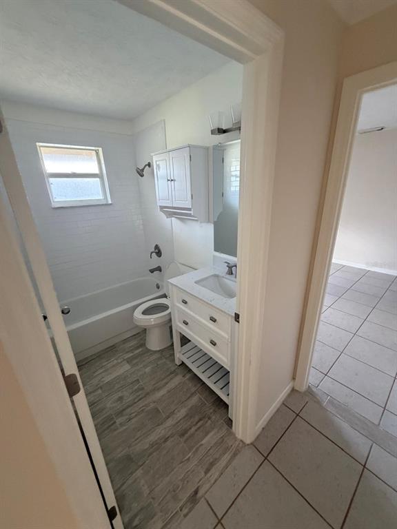 120 Southwest Bedford Road Port St. Lucie, FL 34953 - Photo 18 of 50 a bathroom with a sink toilet and vanity