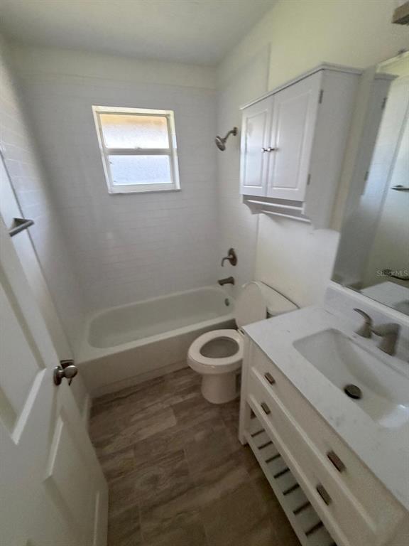 120 Southwest Bedford Road Port St. Lucie, FL 34953 - Photo 19 of 50 a bathroom with a sink a toilet and shower