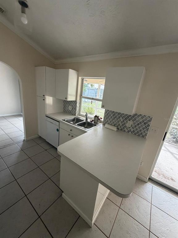 120 Southwest Bedford Road Port St. Lucie, FL 34953 - Photo 29 of 50 a kitchen with stainless steel appliances a refrigerator sink and cabinets