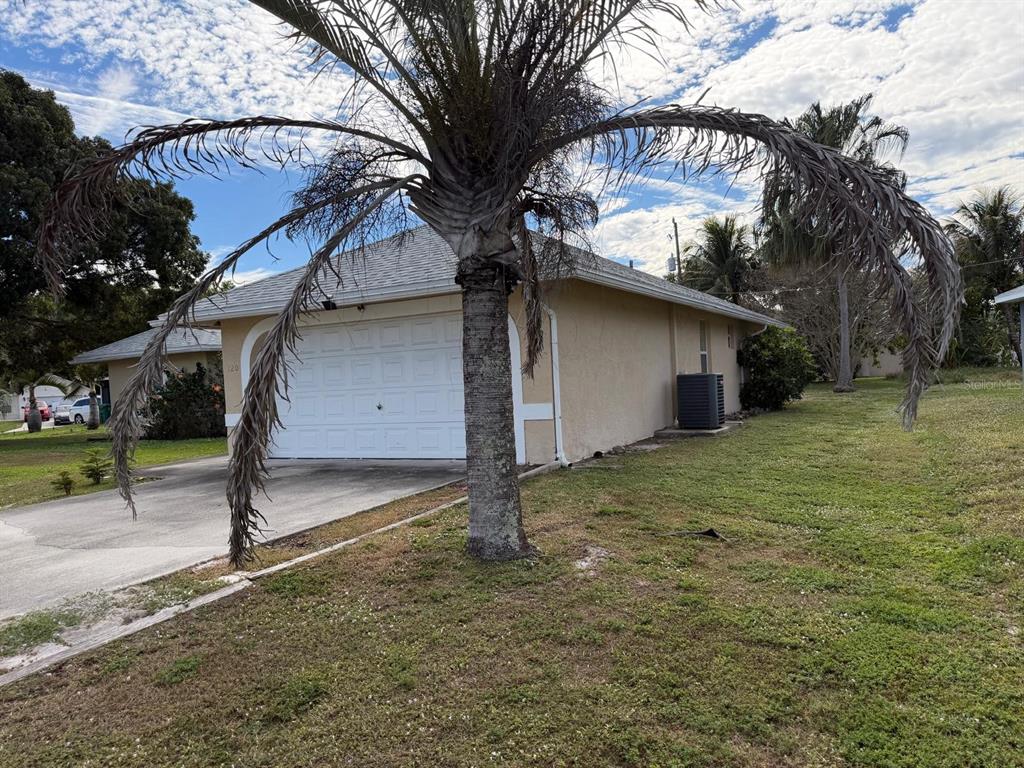 120 Southwest Bedford Road Port St. Lucie, FL 34953 - Photo 3 of 50 a house with a trees in the background