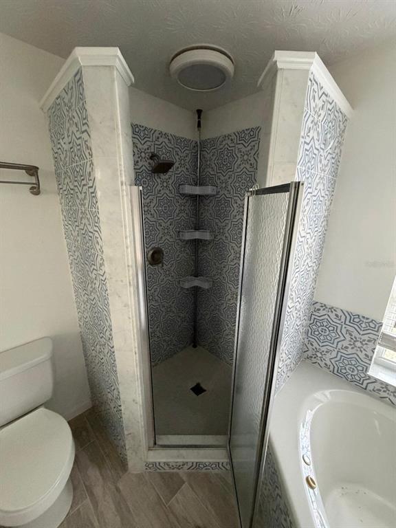 120 Southwest Bedford Road Port St. Lucie, FL 34953 - Photo 39 of 50 a bathroom with a toilet and a shower