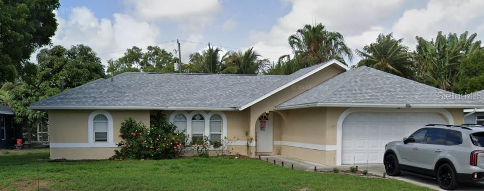 120 Southwest Bedford Road Port St. Lucie, FL 34953 - Photo 4 of 50 a house view with a garden space