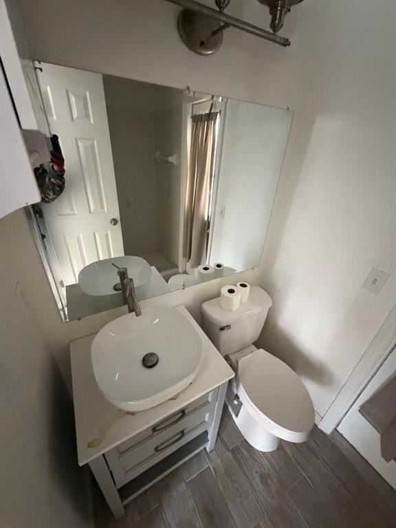 120 Southwest Bedford Road Port St. Lucie, FL 34953 - Photo 49 of 50 a bathroom with a sink and a mirror