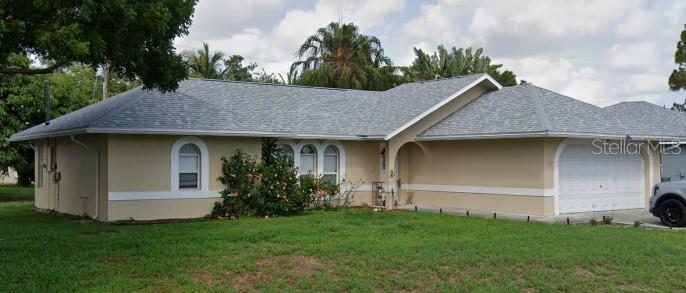 120 Southwest Bedford Road Port St. Lucie, FL 34953 - Photo 5 of 50 a view of a house with a garden