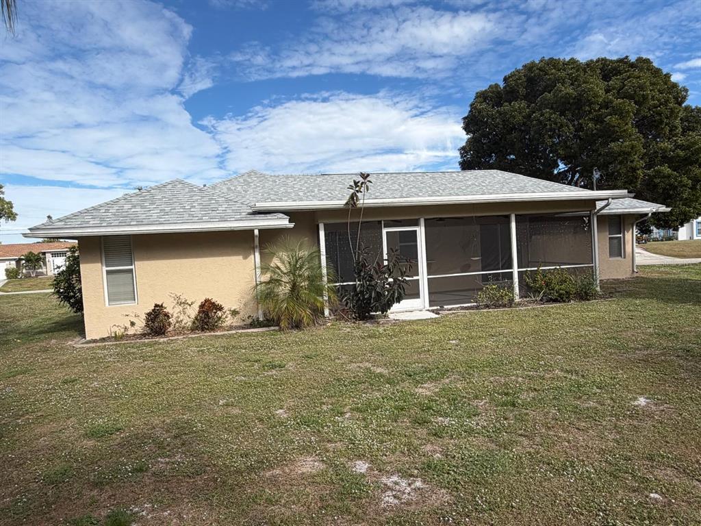 120 Southwest Bedford Road Port St. Lucie, FL 34953 - Photo 7 of 50 a front view of a house with a yard