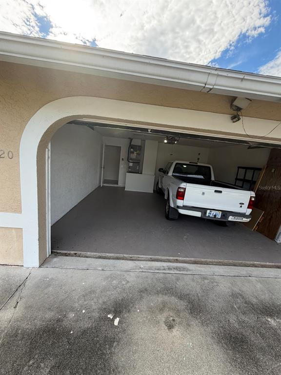 120 Southwest Bedford Road Port St. Lucie, FL 34953 - Photo 10 of 50 a car parked in garage