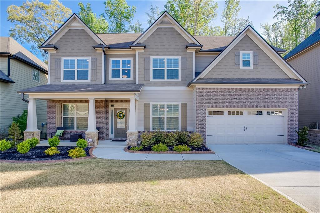 The level front yard and beautiful landscaping with garden edging creates a fantastic curb appeal. 