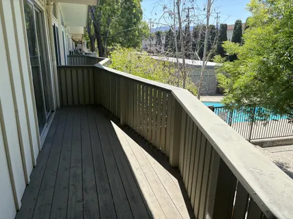 a view of balcony and yard