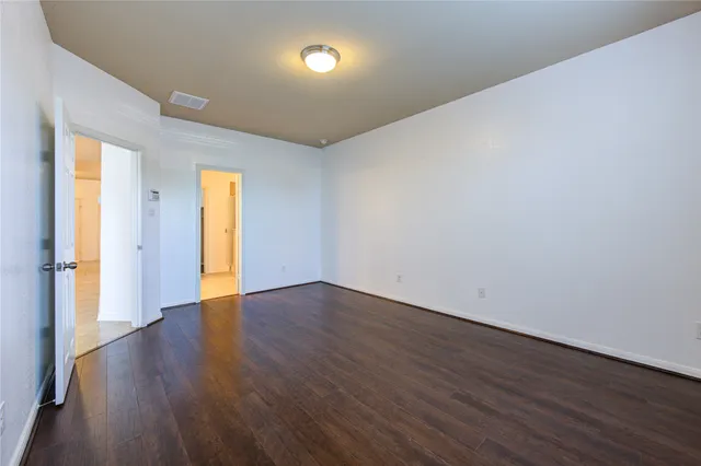 a bathroom with double vanity sinks a mirror and a shower