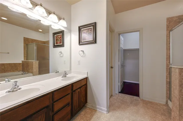 a bathroom with a tub and shower