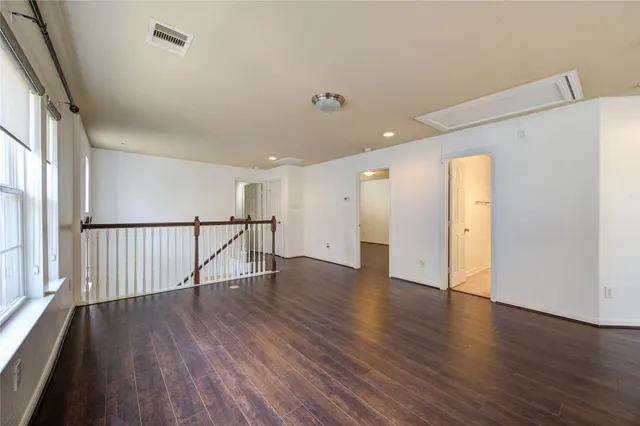 a view of an entryway with wooden floor and stairs