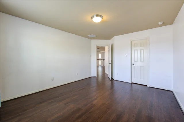 a bathroom with a sink a toilet a mirror and bathtub