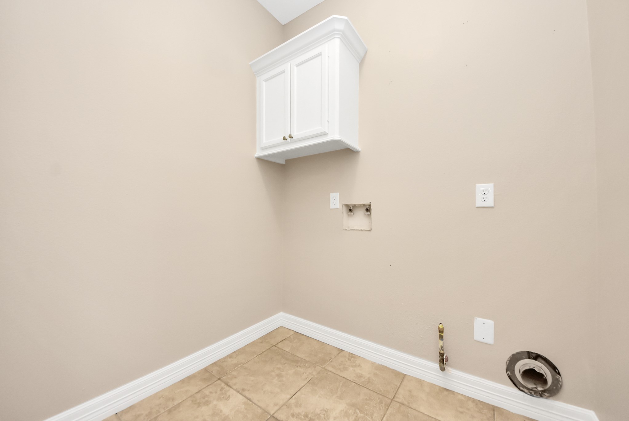 4320 Barkaloo Road Baytown, TX 77521 - Photo 12 of 28 a view of a utility room with racks on the wall