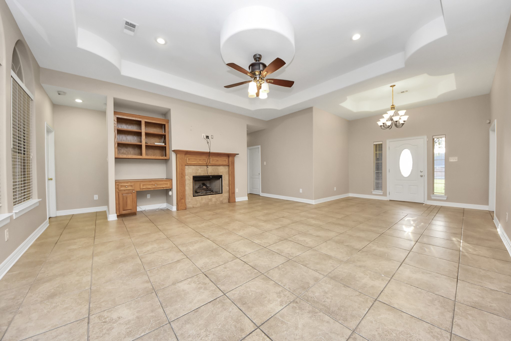 4320 Barkaloo Road Baytown, TX 77521 - Photo 15 of 28 a view of an empty room with a ceiling fan a kitchen view and a window