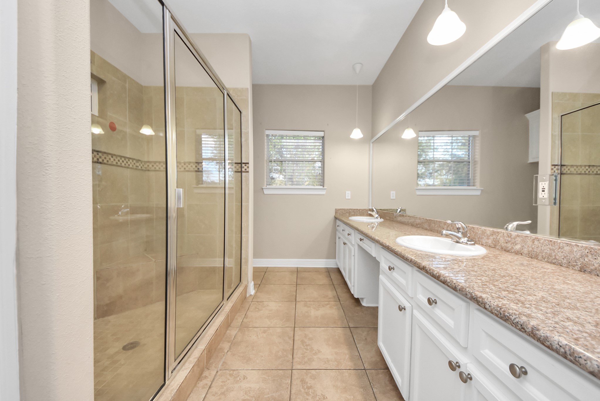 4320 Barkaloo Road Baytown, TX 77521 - Photo 26 of 28 a bathroom with a granite countertop sink a mirror and a shower