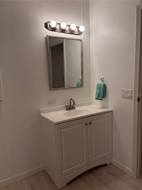 1622 Southwest 35th Circle Okeechobee, FL 34974 - Photo 15 of 19 a bathroom with a sink and a mirror