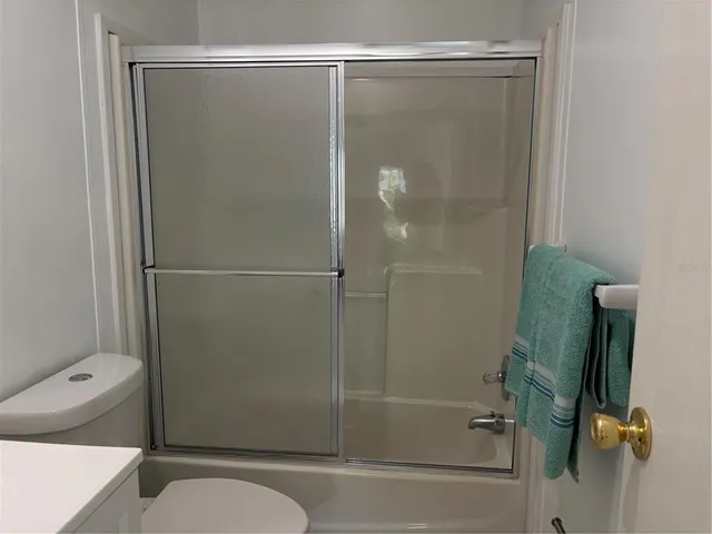 a bathroom with a shower and a toilet