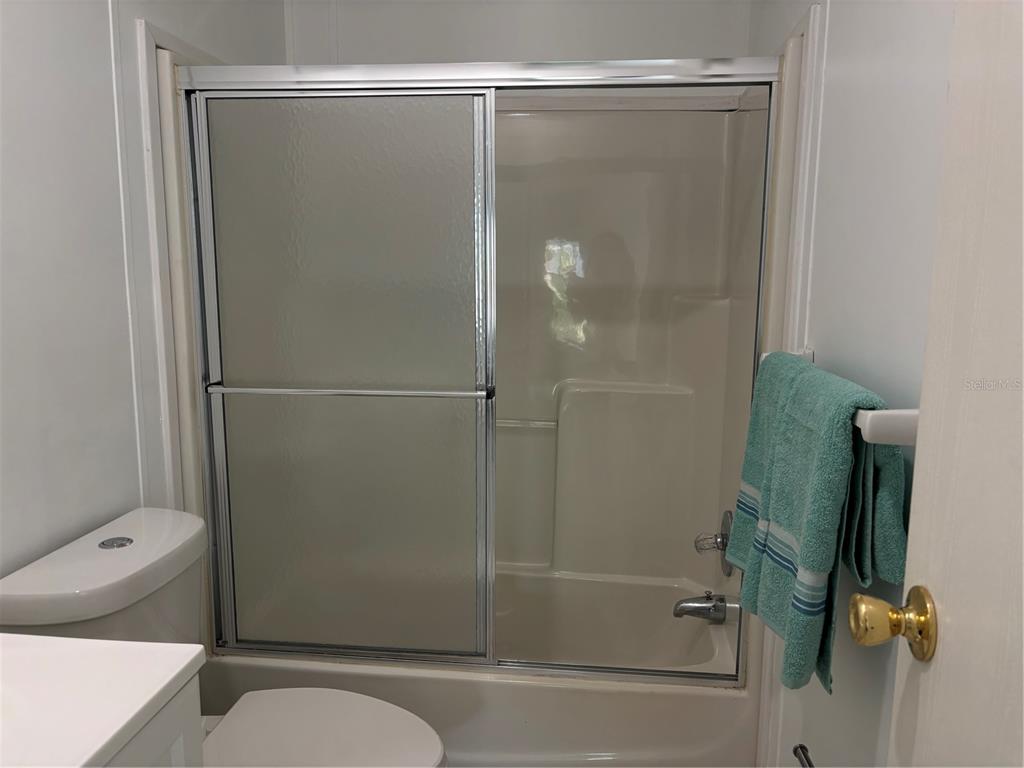 1622 Southwest 35th Circle Okeechobee, FL 34974 - Photo 10 of 19 a bathroom with a shower and a toilet