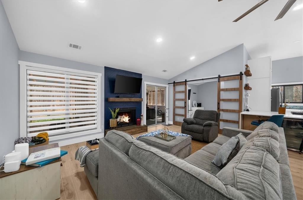 5802 Bay Pointe Sound Acworth, GA 30101 - Photo 12 of 41 a living room with furniture and a fireplace