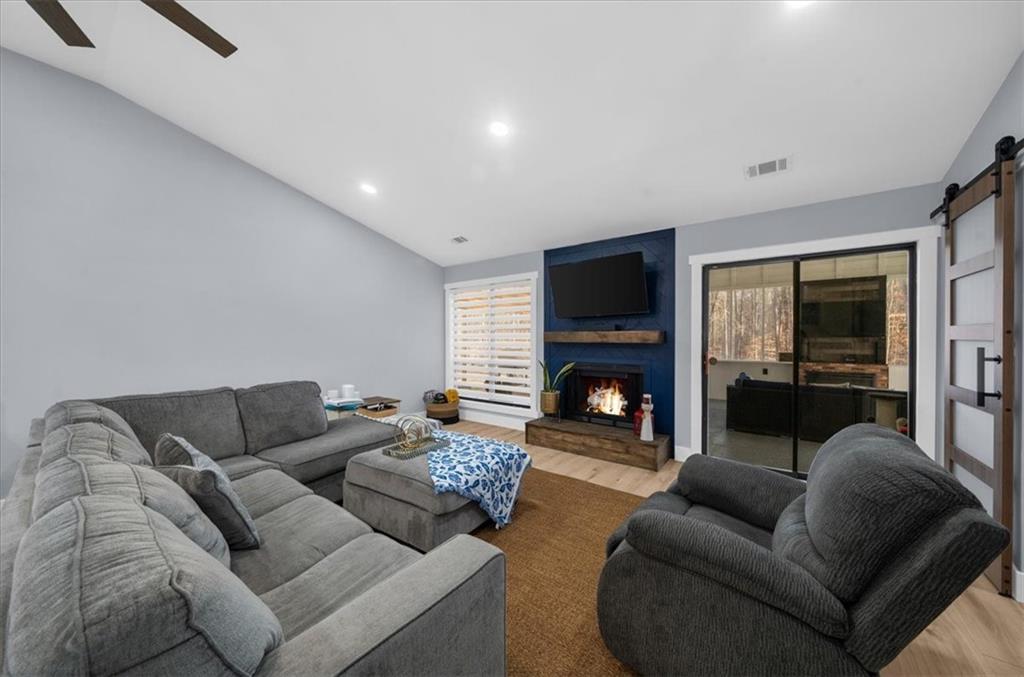 5802 Bay Pointe Sound Acworth, GA 30101 - Photo 13 of 41 a living room with furniture and a fireplace