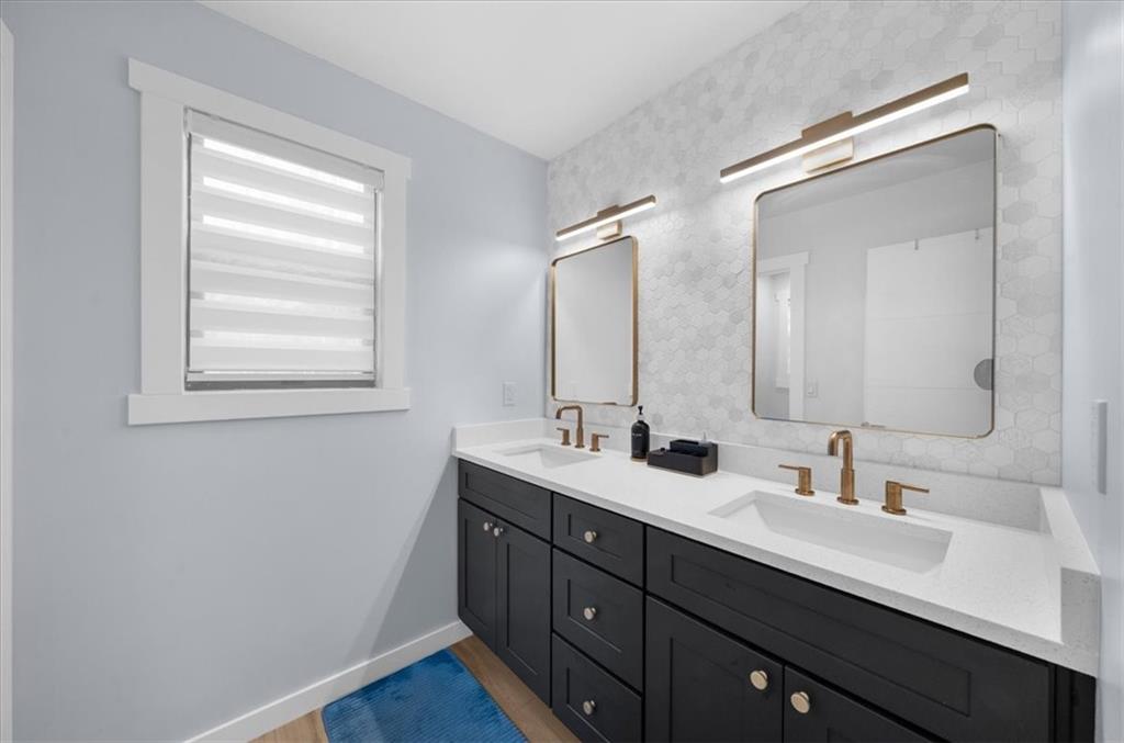 5802 Bay Pointe Sound Acworth, GA 30101 - Photo 17 of 41 a bathroom with a double vanity sink and mirror