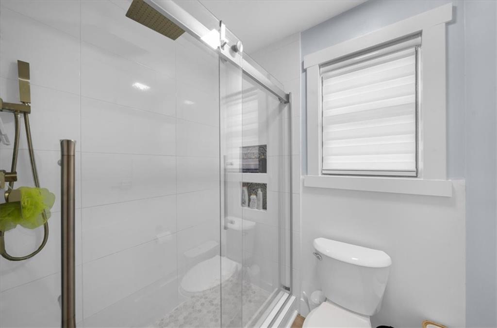 5802 Bay Pointe Sound Acworth, GA 30101 - Photo 19 of 41 a bathroom with a toilet and a shower