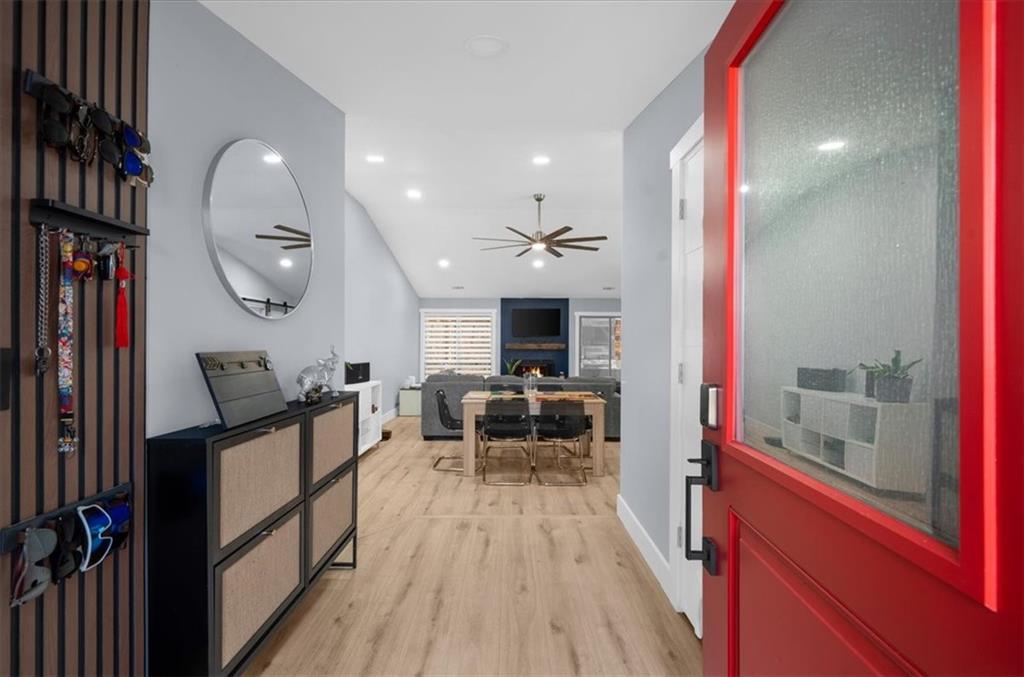 5802 Bay Pointe Sound Acworth, GA 30101 - Photo 2 of 41 a view of a living room and dining room with furniture a chandelier and wooden floor