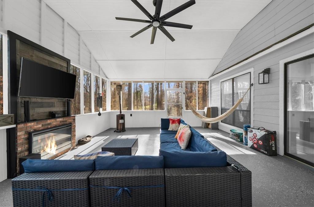 5802 Bay Pointe Sound Acworth, GA 30101 - Photo 28 of 41 a living room with furniture a flat screen tv and a large window