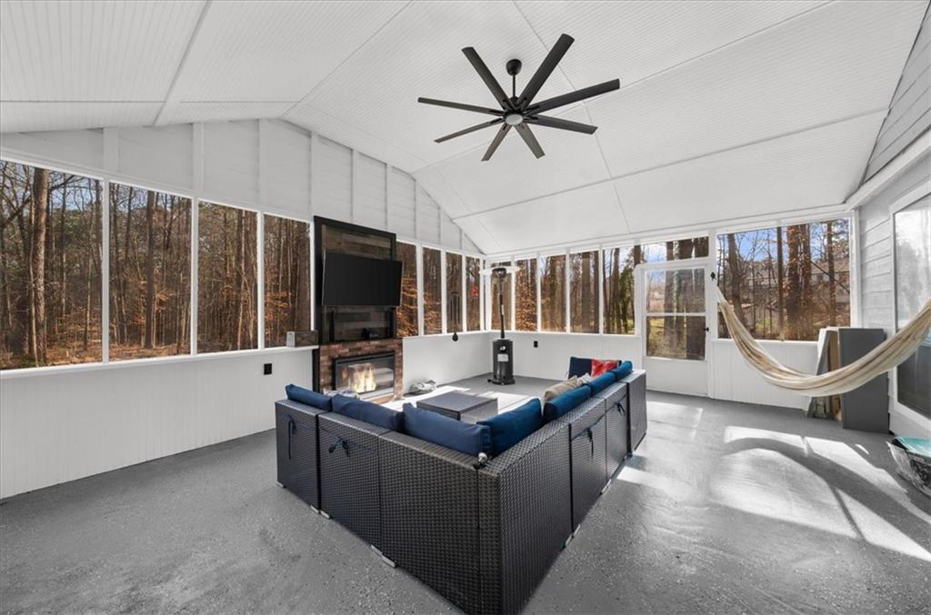 5802 Bay Pointe Sound Acworth, GA 30101 - Photo 29 of 41 a living room with furniture a flat screen tv and a large window